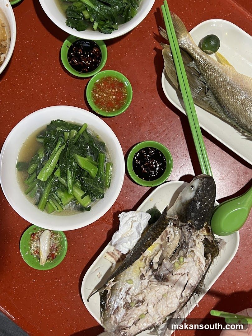 Dining Table with Fish and Vegetables