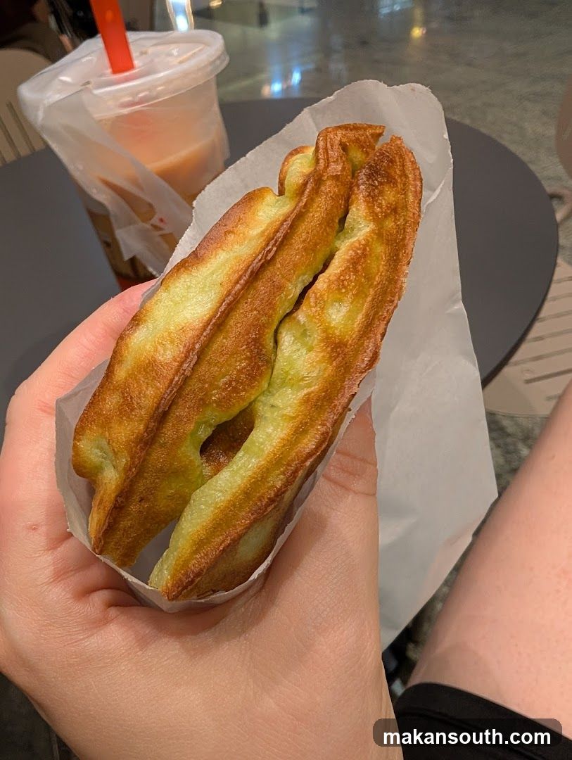 Handheld Matcha Waffle Sandwich with Iced Drink