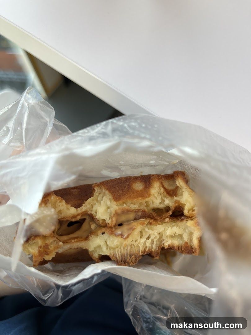 Half-eaten sandwich in plastic bag