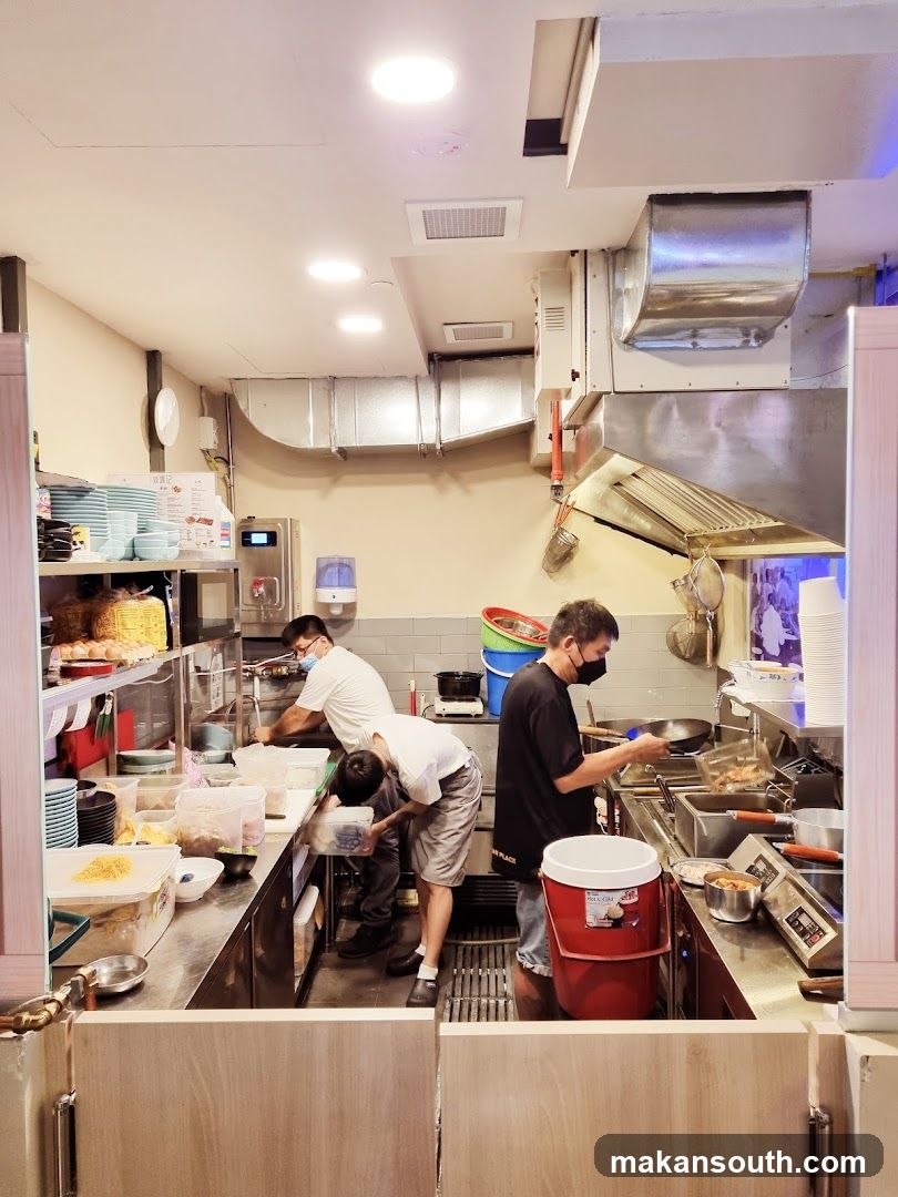 Kitchen Interior with Staff Cooking