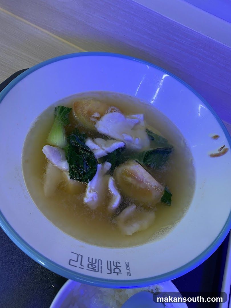Bowl of Soup with Vegetables and Meat