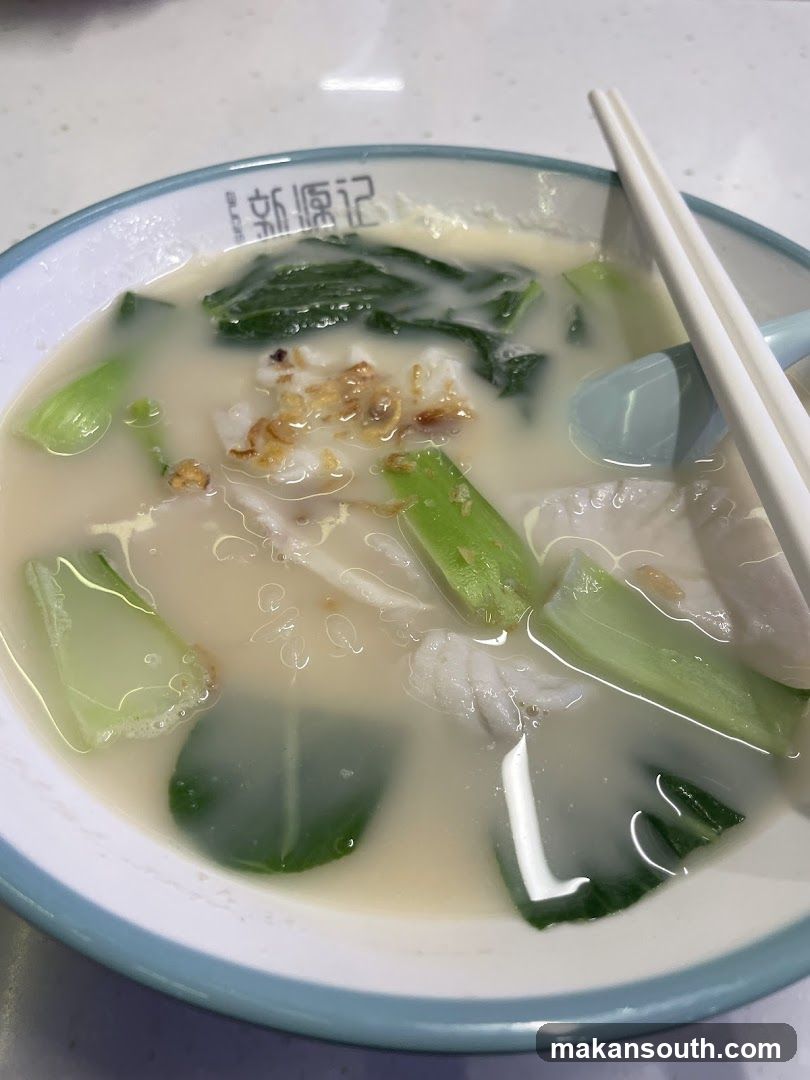 Bowl of Soup with Vegetables and Meat