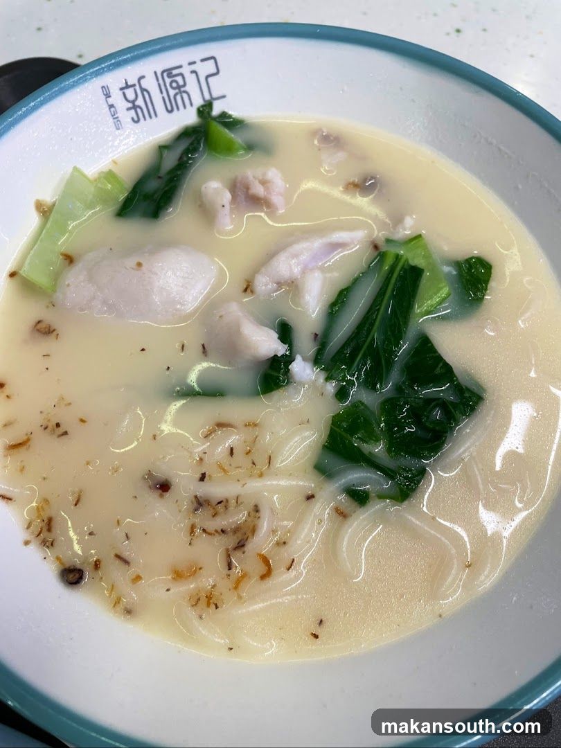 Bowl of Noodle Soup with Chicken and Greens
