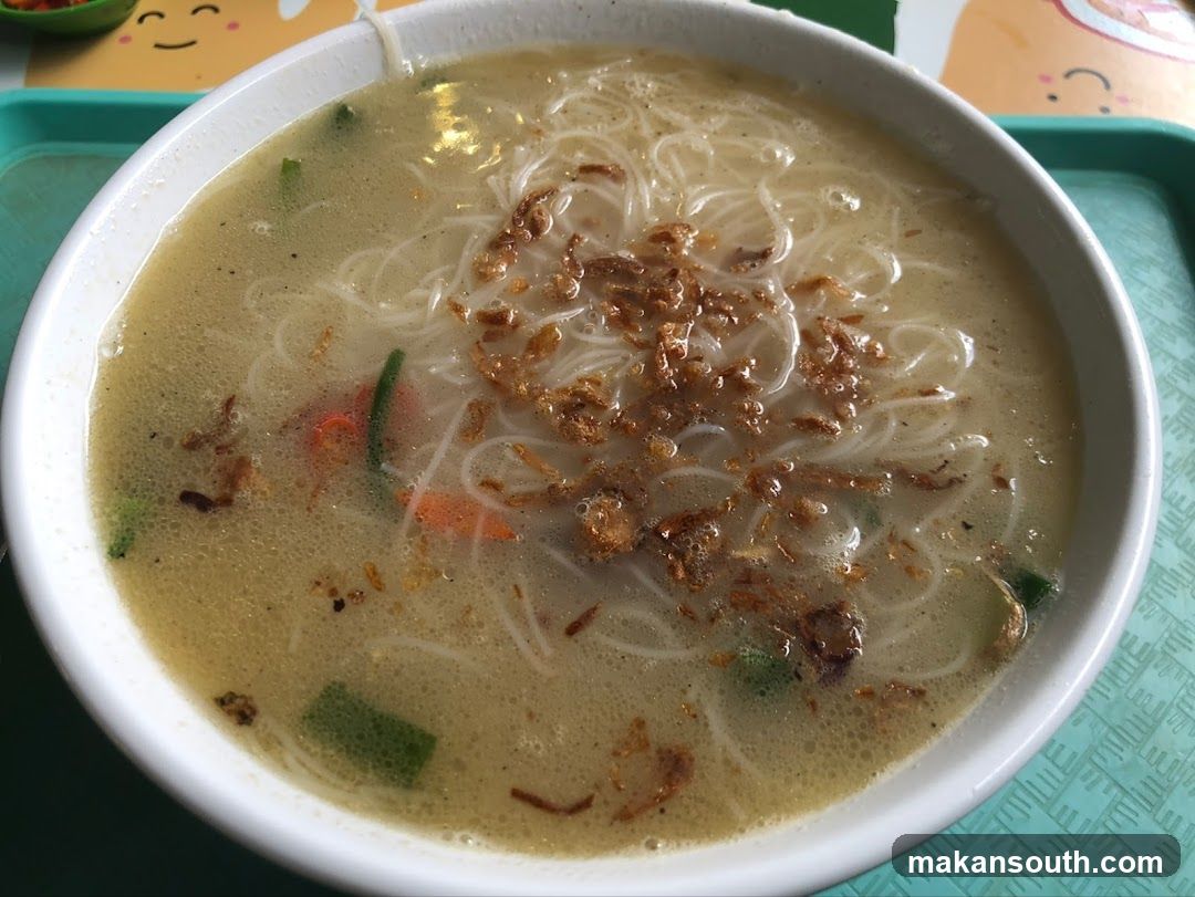 Bowl of Noodle Soup with Fried Onions