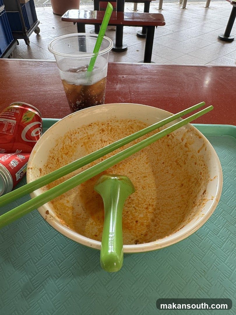 Empty bowl with chopsticks and drink