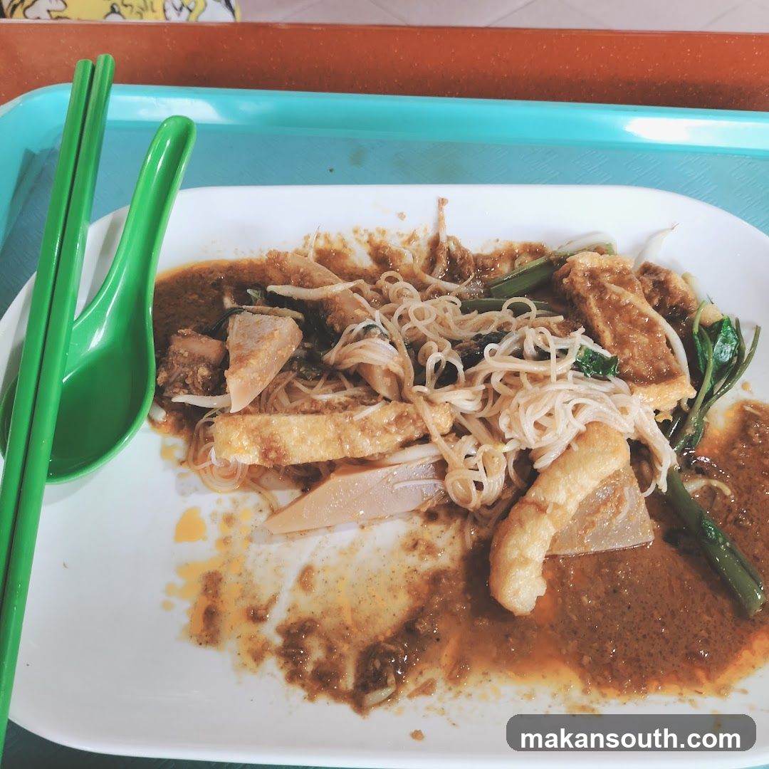 Noodle Dish with Green Chopsticks and Spoon