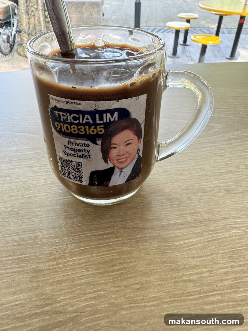 Iced coffee with property specialist sticker