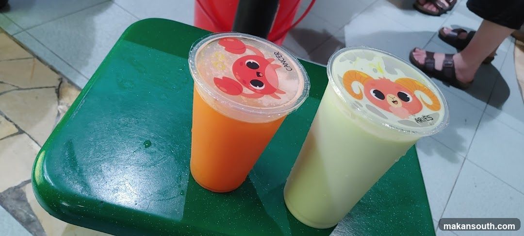 Two drinks on a green tray