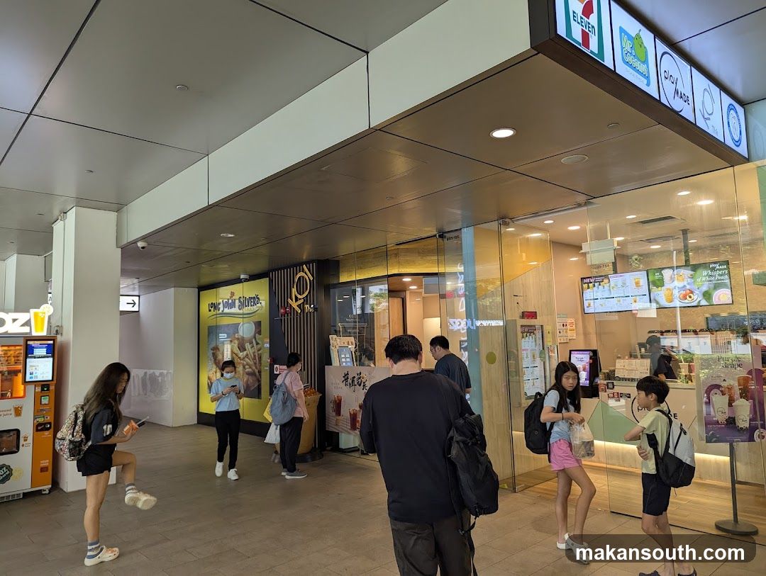 7-Eleven Store Entrance with People