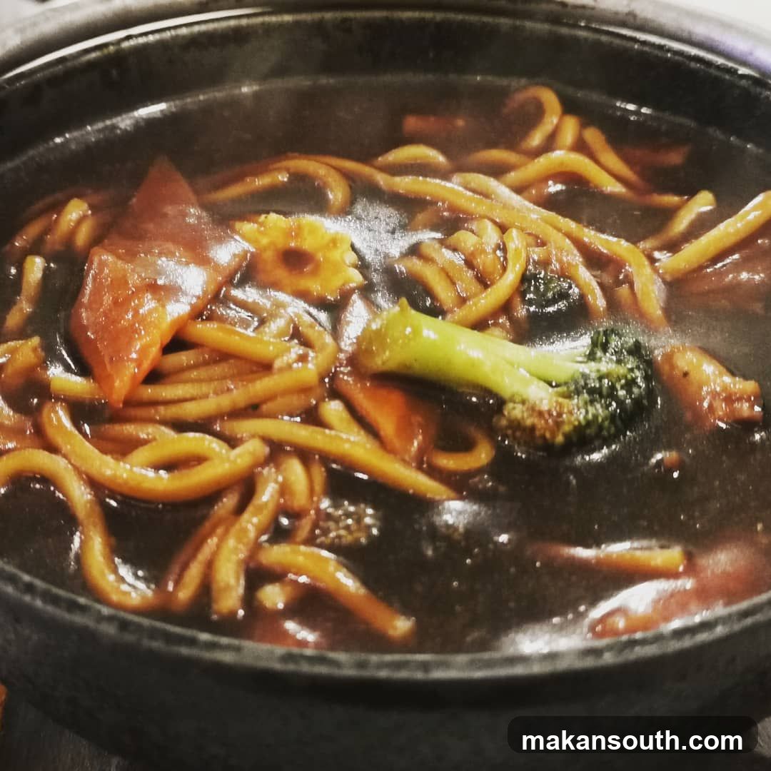 Sizzling Noodle Dish in Clay Pot