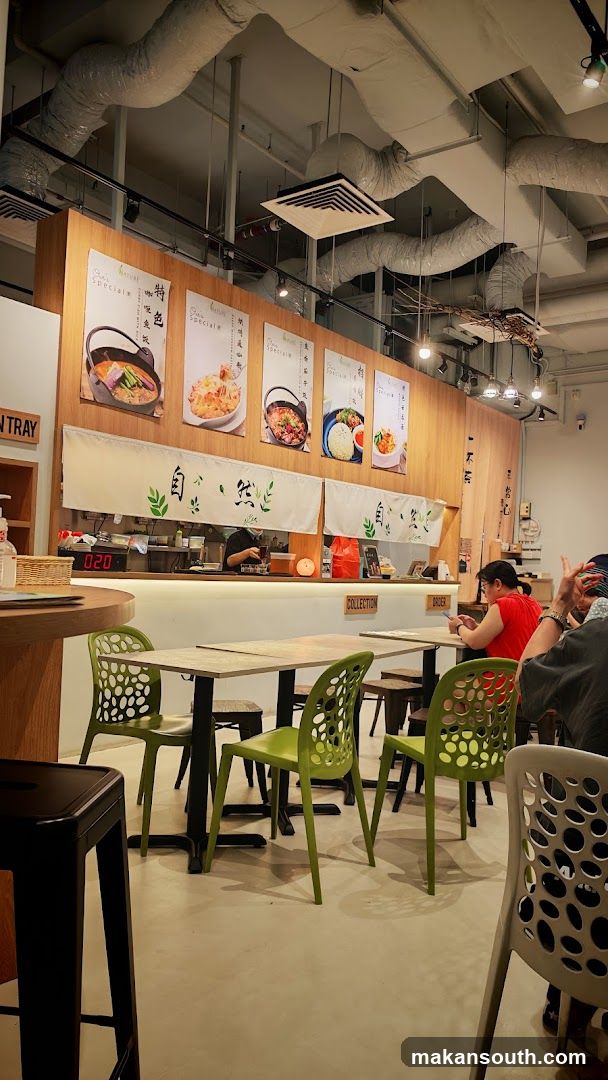 Restaurant Interior with Wooden Wall and Green Chairs