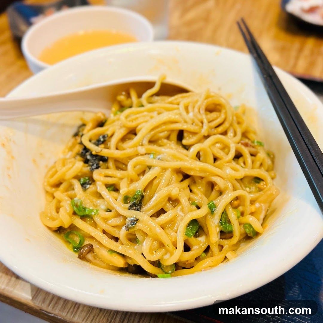 Bowl of Noodles with Sauce and Garnish