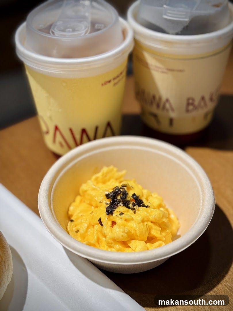 Breakfast Meal with Scrambled Eggs and Drinks