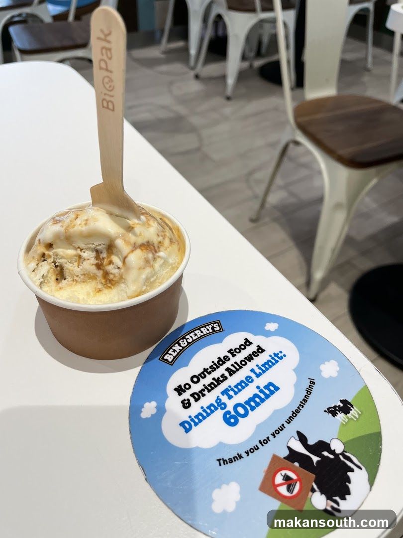 Ben & Jerry's Ice Cream Cup with Dining Rules Sign