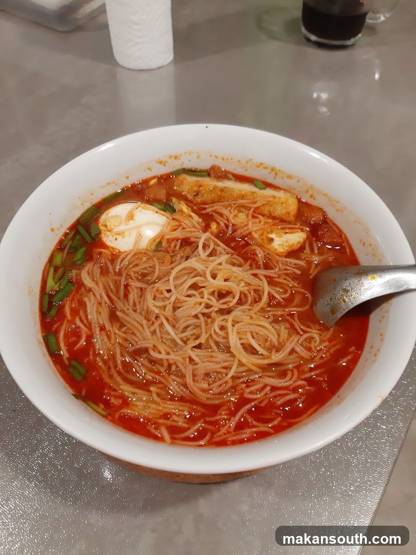 Bowl of Spicy Noodles with Egg and Tofu