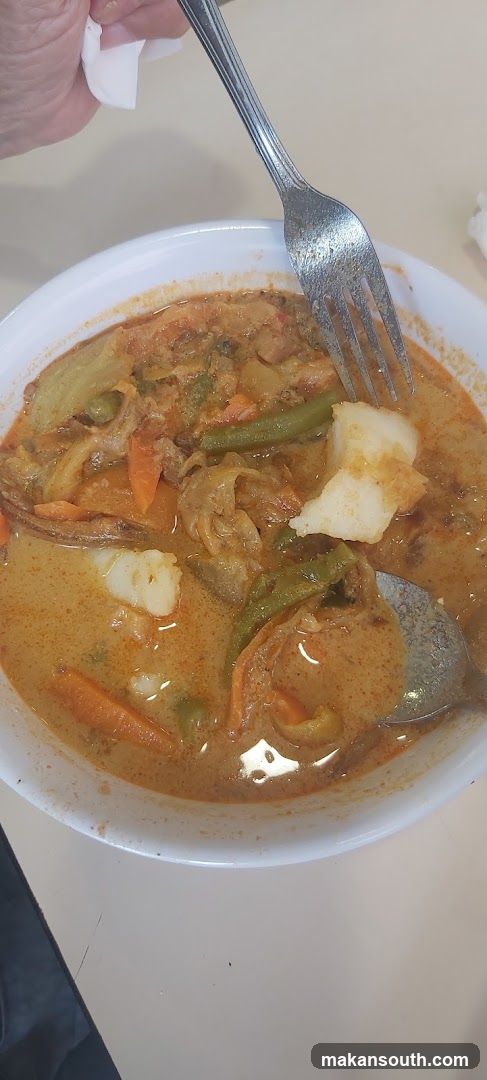 Curry Dish with Fork and Spoon