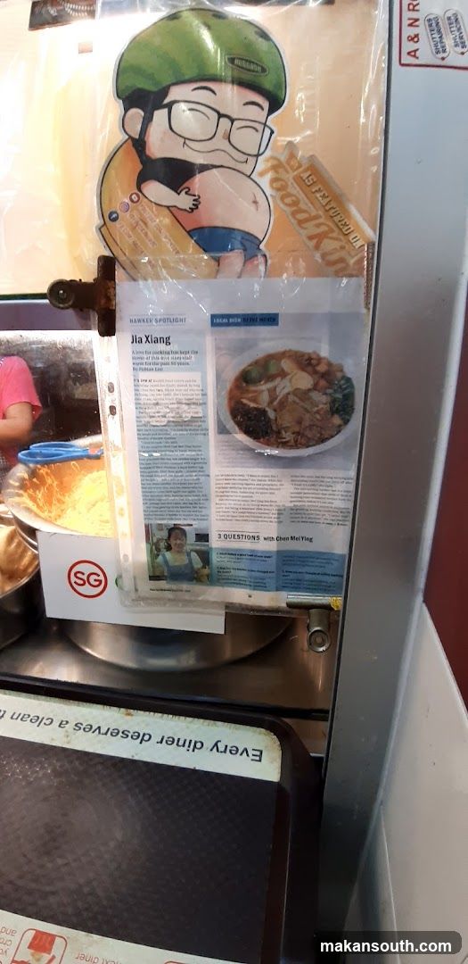 Food stall display with magazine insert