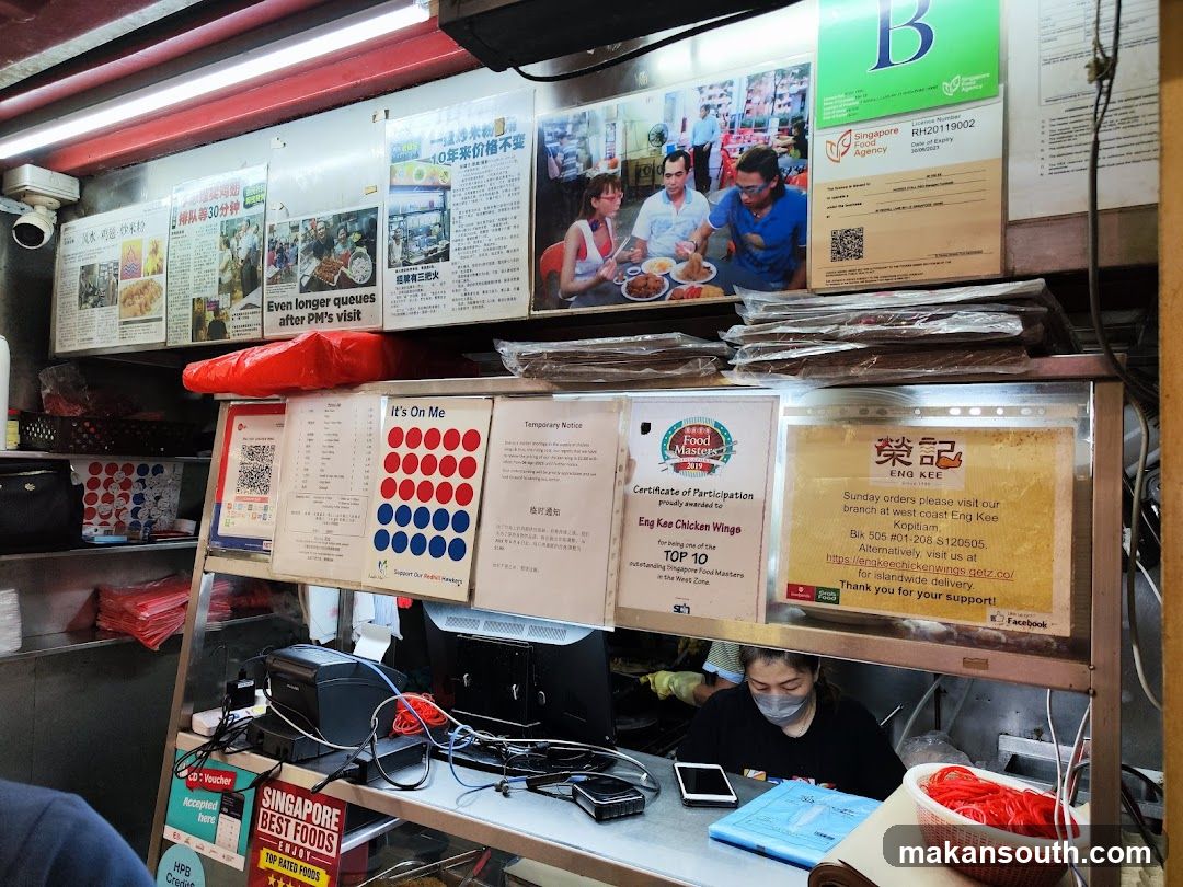 Food Stall Interior with Signage and Staff