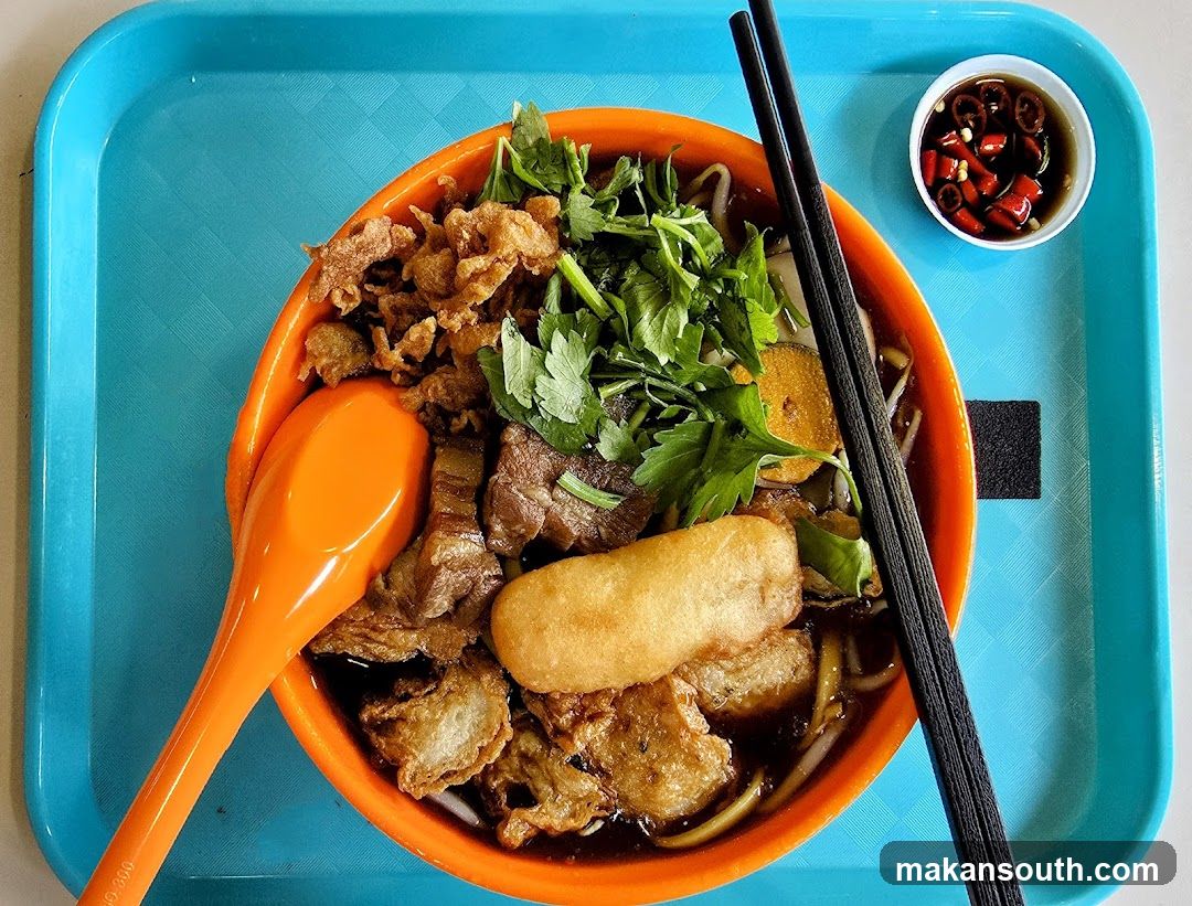 Noodle Bowl with Chopsticks and Spoon
