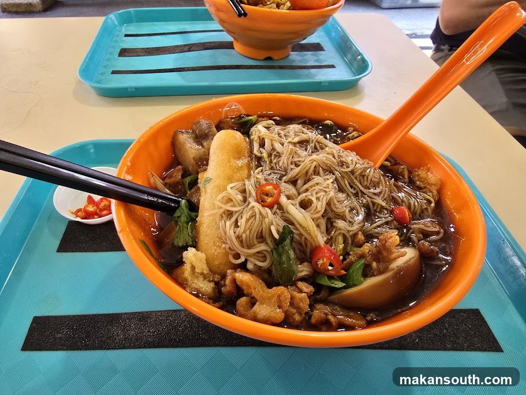 Noodle Bowl with Chopsticks and Spoon