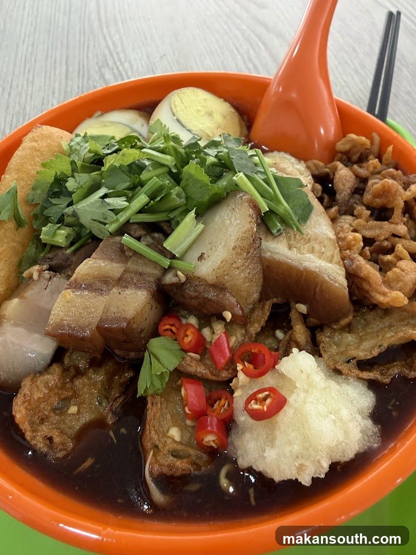 Bowl of Char Kway Teow with Tofu Puffs and Pork Belly