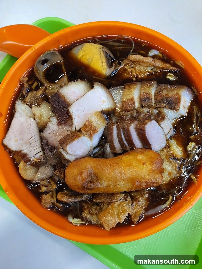 Bowl of Noodle Soup with Meat and Fried Dough