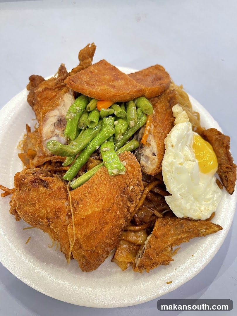 Fried Chicken and Noodles with Fried Egg