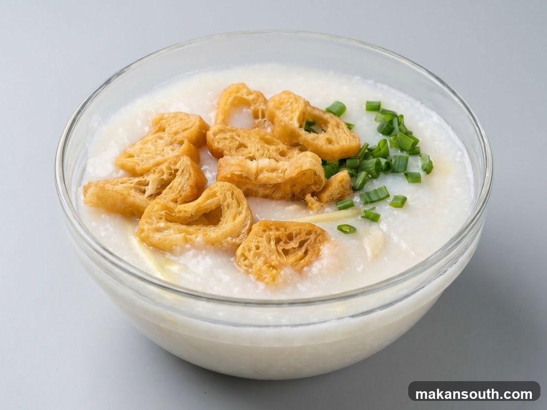 Bowl of Porridge with Fried Dough and Scallions