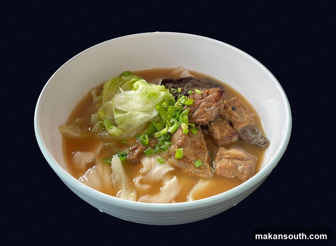 Bowl of Noodle Soup with Meat and Greens