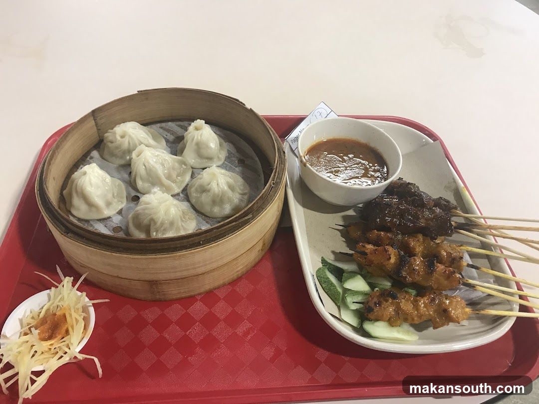 Dumplings and Satay on a Red Tray