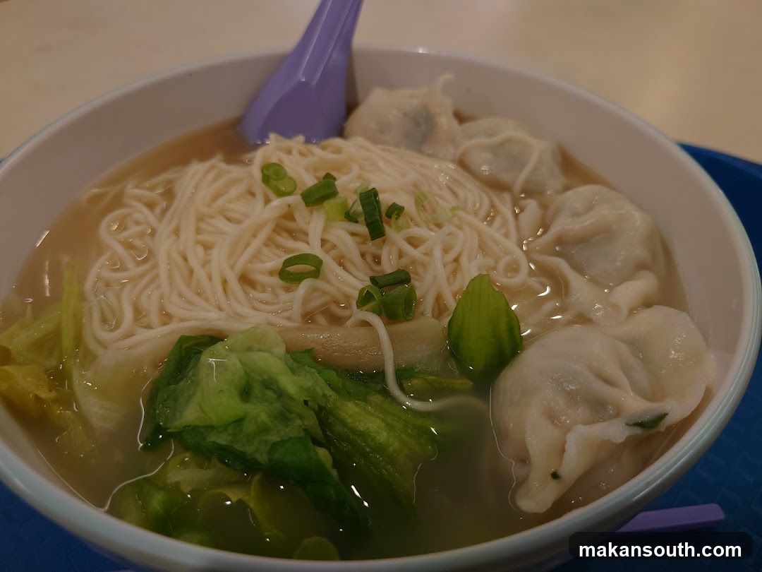 Bowl of Noodles with Dumplings and Greens