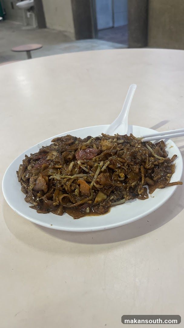 Plate of Fried Noodles with Chopsticks and Spoon