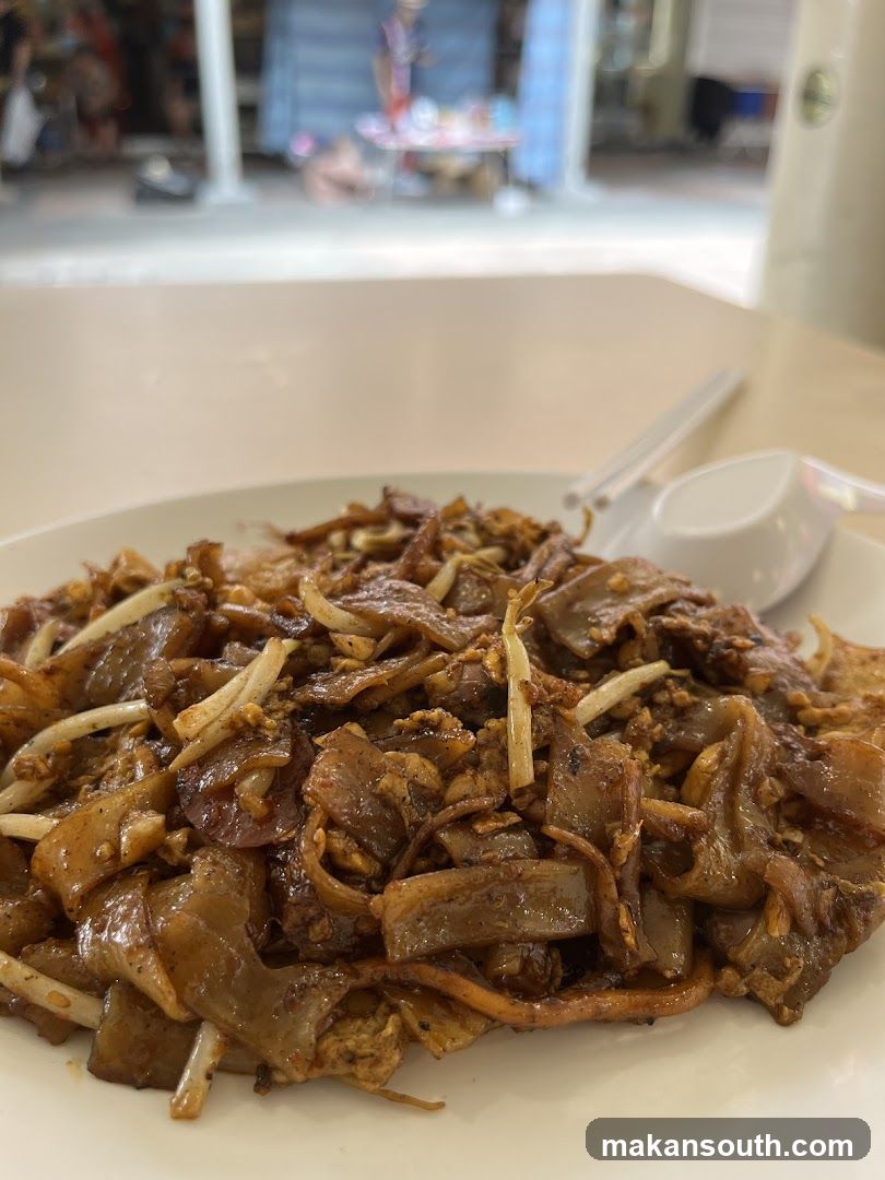 Plate of Stir-fried Noodles with Meat and Bean Sprouts