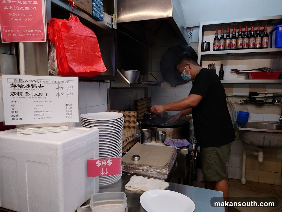 Kitchen Interior with Chef Cooking