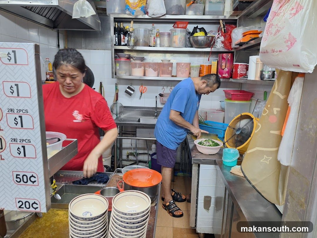 Kitchen Interior with Staff Preparing Food