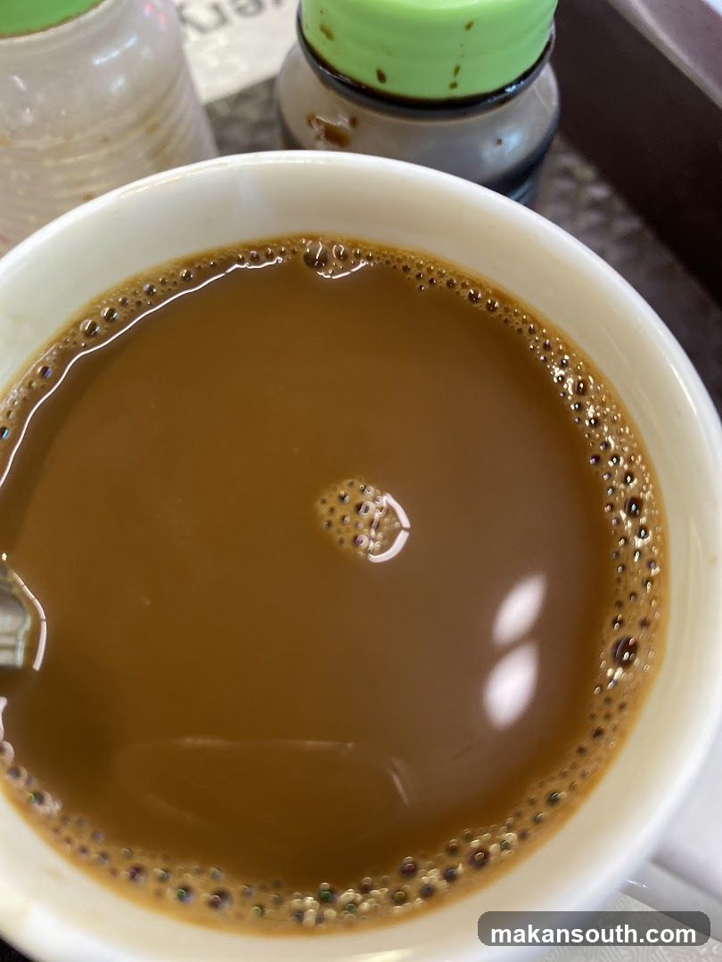 Cup of Coffee with Condiments