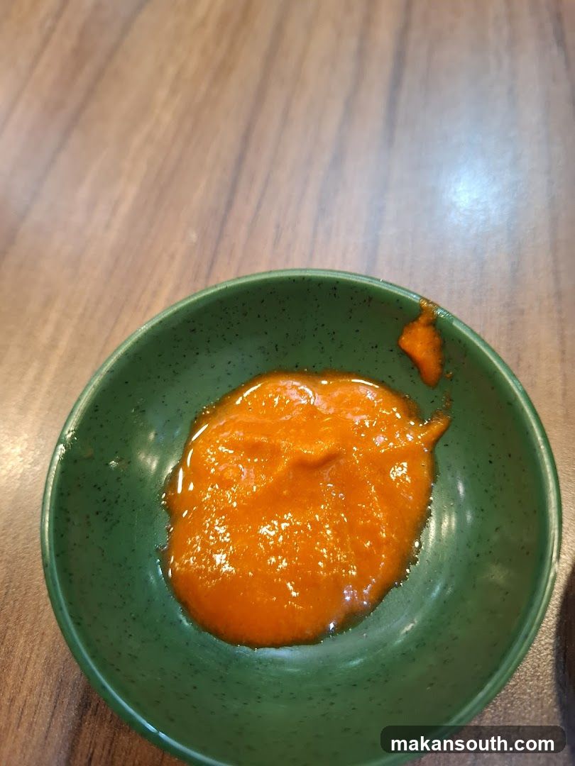 Orange Sauce in Green Bowl