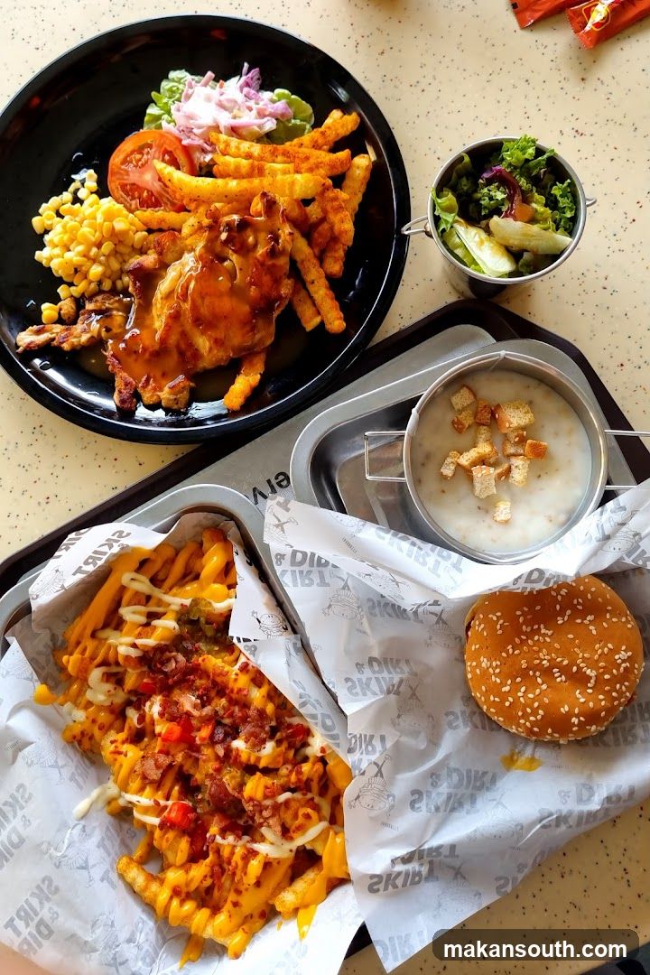 Food Spread with Fries, Chicken, and Soup