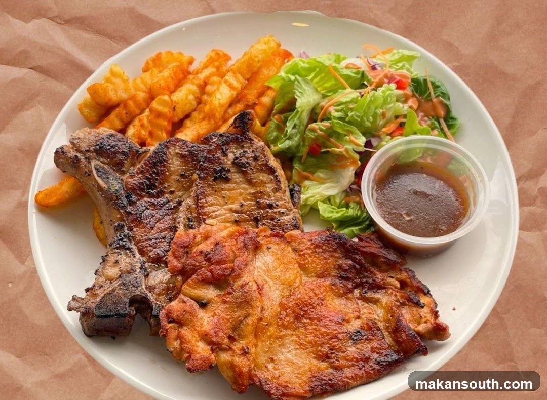 Grilled Pork Chop Plate with Fries and Salad