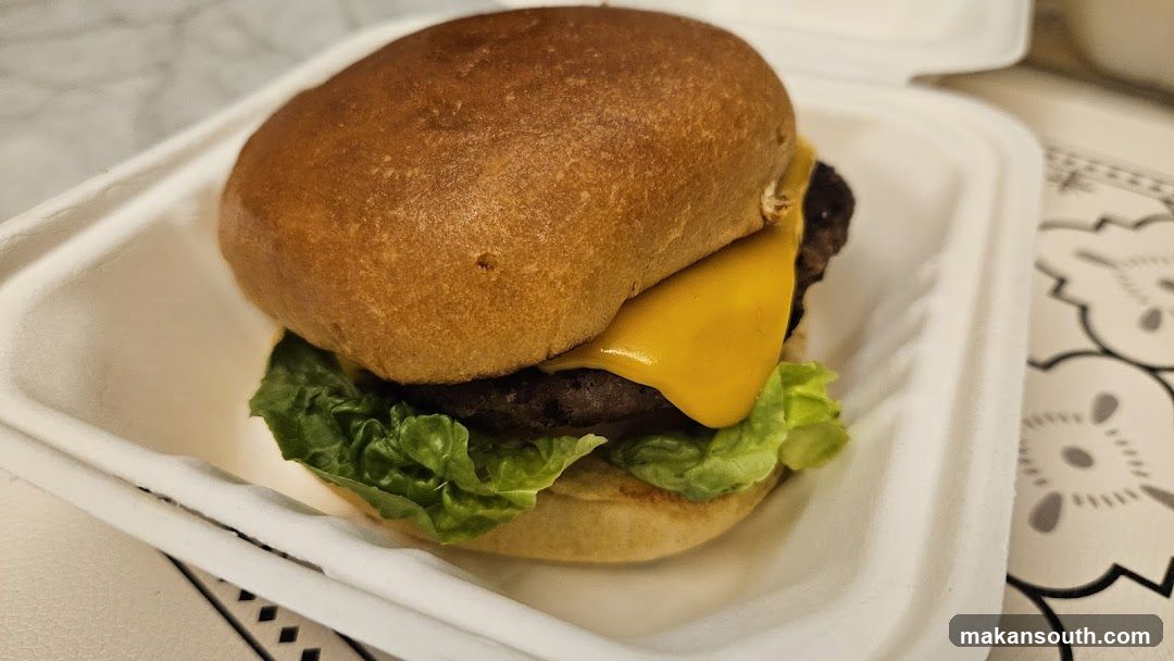 Cheeseburger in Takeout Container