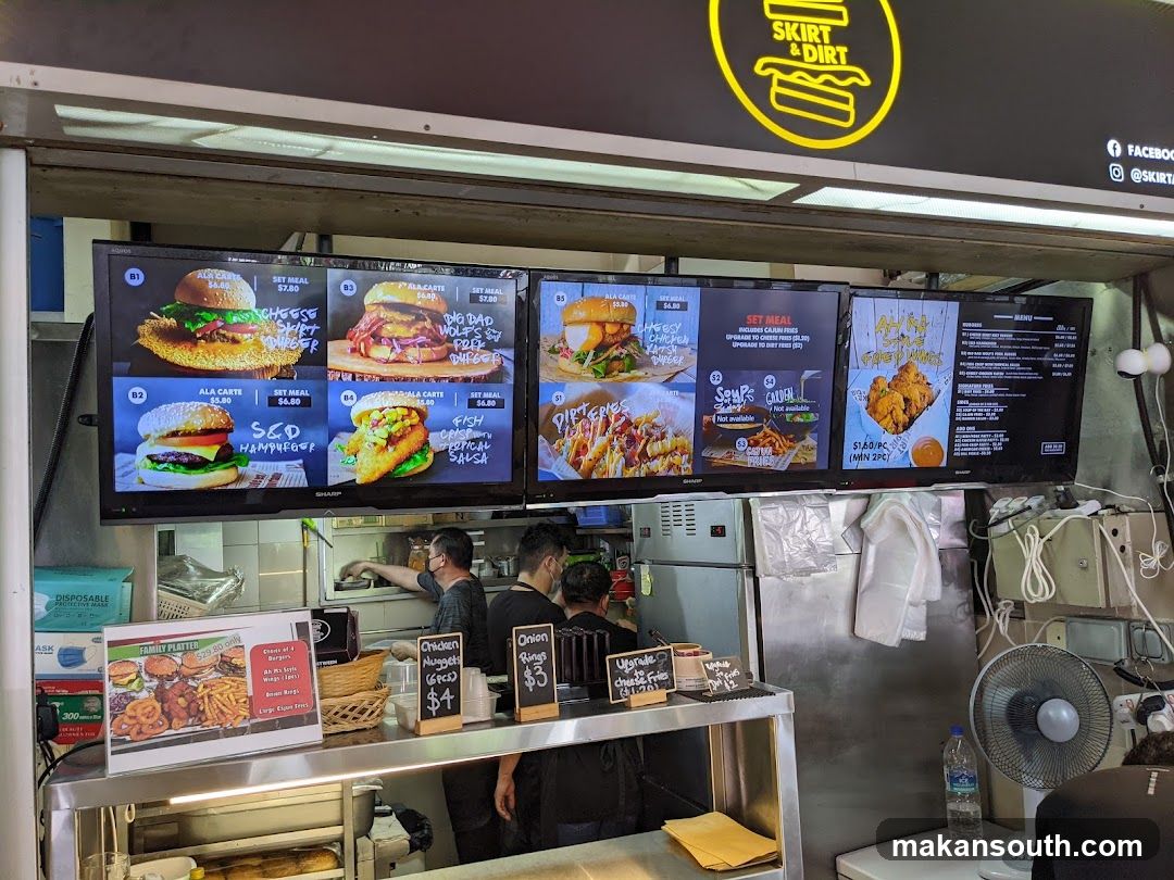 Food Stall Interior with Menu Boards and Staff