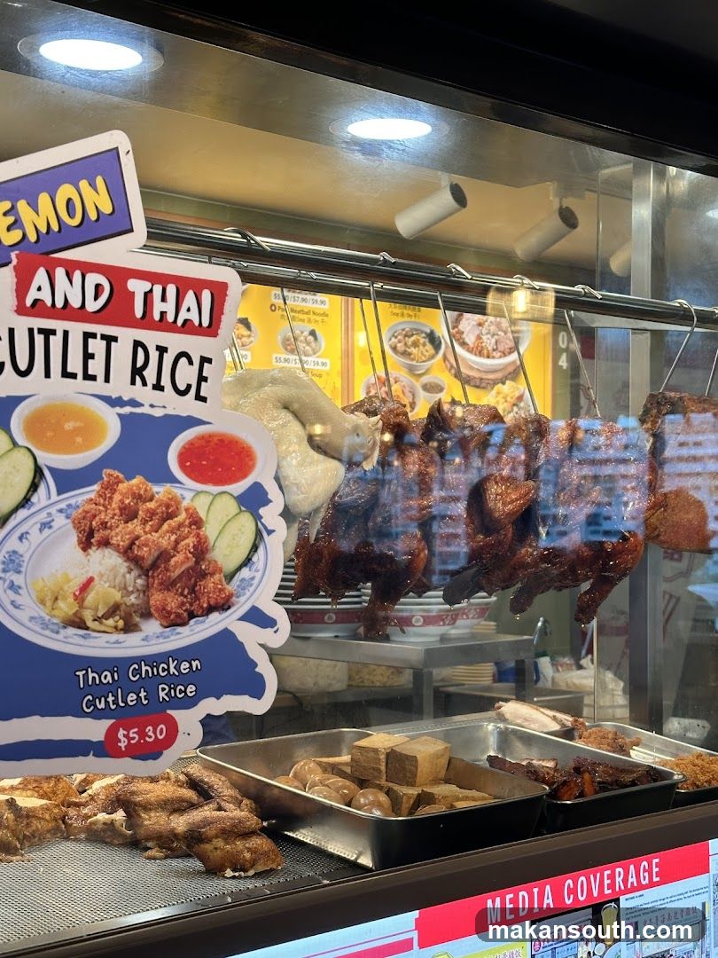 Food Display Case with Hanging Roasted Chicken and Cutlet Rice Signage