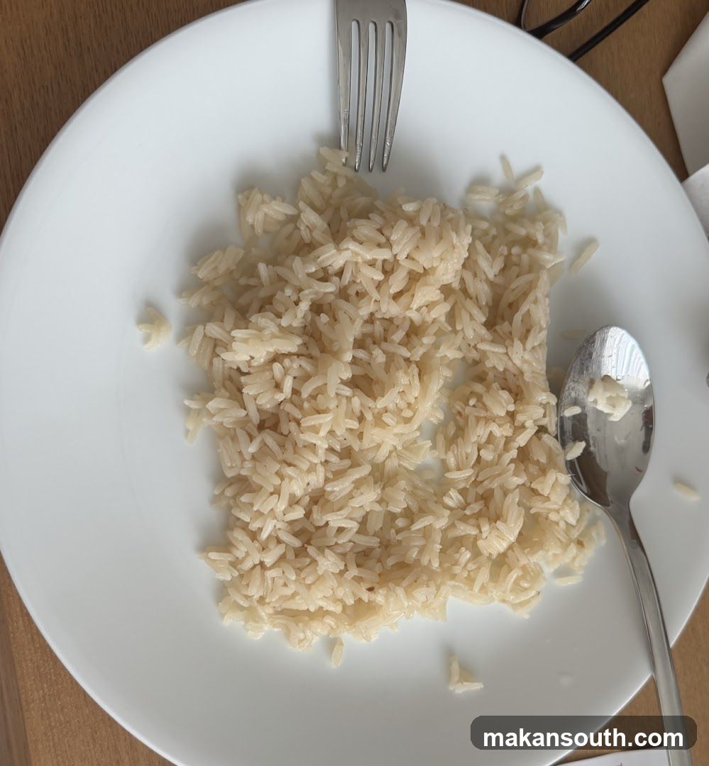 Plate of White Rice with Cutlery