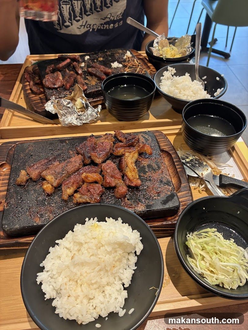 Sizzling Meat Platter with Rice and Side Dishes
