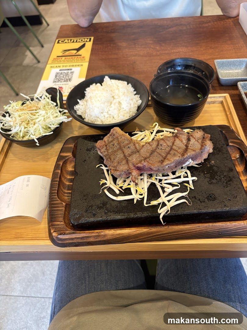 Steak Meal with Rice and Side Dishes