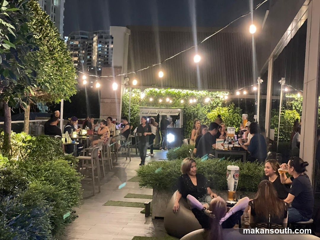 Outdoor Night Gathering at Rooftop Bar