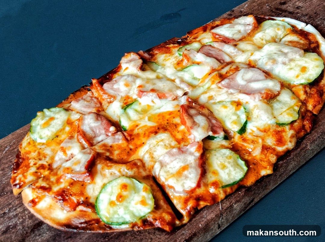 Wooden Board Pizza with Zucchini and Ham