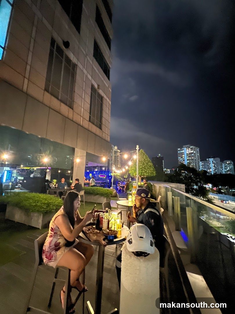 Nighttime Rooftop Dining Scene