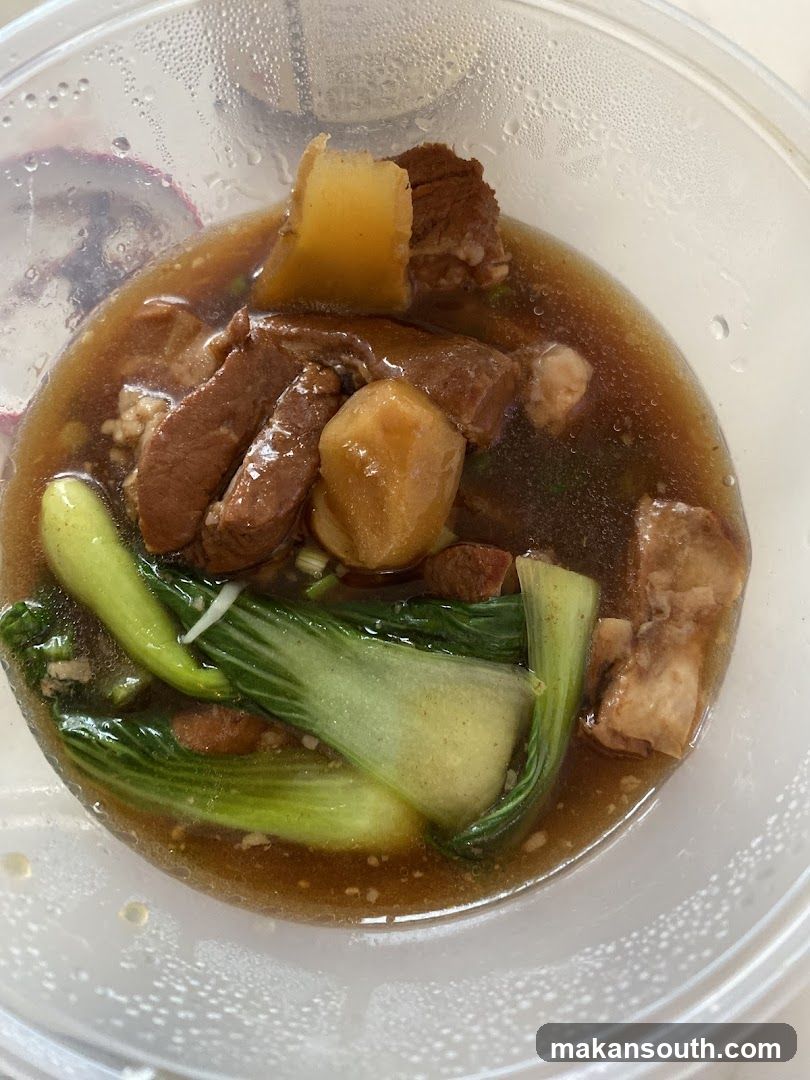 Braised Meat and Vegetable Dish in Takeout Container