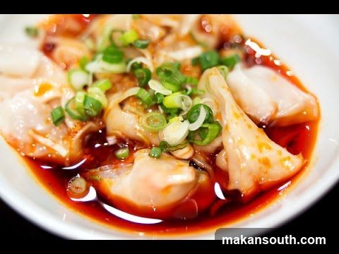 Dish with Red Sauce and Green Onions